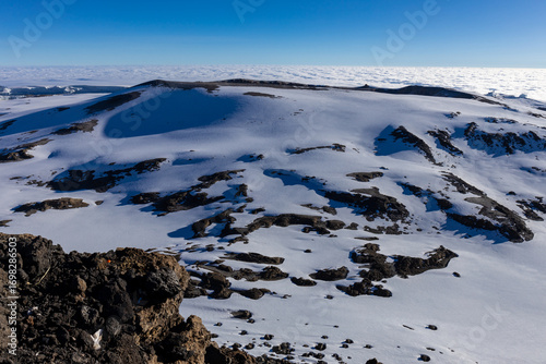 Mount Kilimanjaro hiking trail, way to the summit of mount Kili the highest volcano in Africa, Tanzania. View from top of mountain Kilimanjaro. Snow and glacier on top of Kilimanjaro, Mount Kili