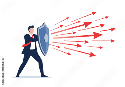 Business professional actively defending against incoming arrows of challenges and threats with a sturdy shield