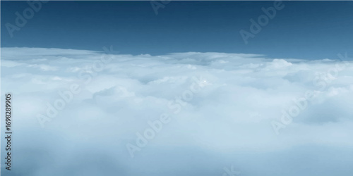 A clear blue sky with fluffy white clouds drifts by on a beautiful summer day