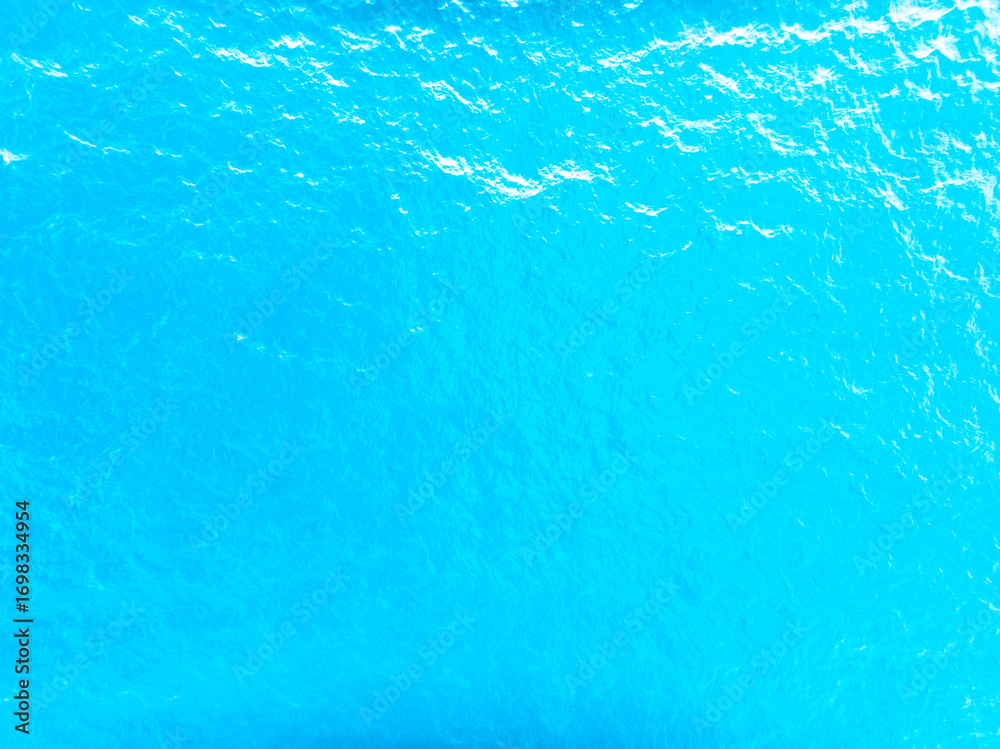 Fototapeta premium Sea surface aerial view,Bird eye view photo of waves and water surface texture,Amazing sea background Beautiful nature sky sea background