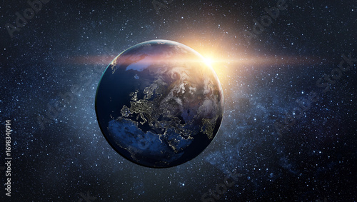 Fototapeta Naklejka Na Ścianę i Meble -  View from space of the sunrise over planet Earth. Elements of this image furnished by NASA.