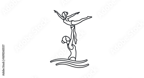 Synchronized swimmers performing a lift in water.