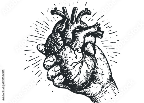 Hand holding anatomical heart, symbolic representation