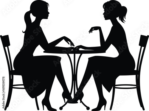 silhouette of a couple sitting in a cafe