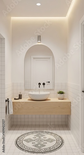 Modern minimalist bathroom interior with wooden vanity, white vessel sink, arched mirror, and patterned floor rug.