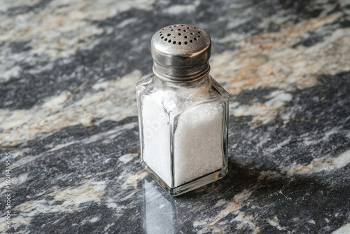 salt and pepper on black background