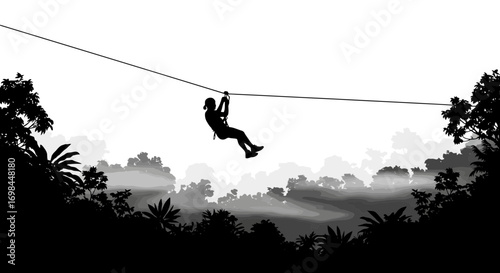 Silhouette of a person zip lining through a lush jungle canopy