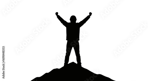 Silhouette of a person with arms raised in triumph on a mountain peak