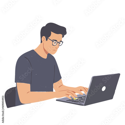 A focused young man with glasses wearing a grey t-shirt is typing on a laptop computer.