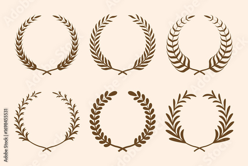 Gold laurel wreath. Golden silhouette laurel foliate wreaths award, achievement, chaplet, heraldry, nobility. Golden leaf silhouette on black background.	