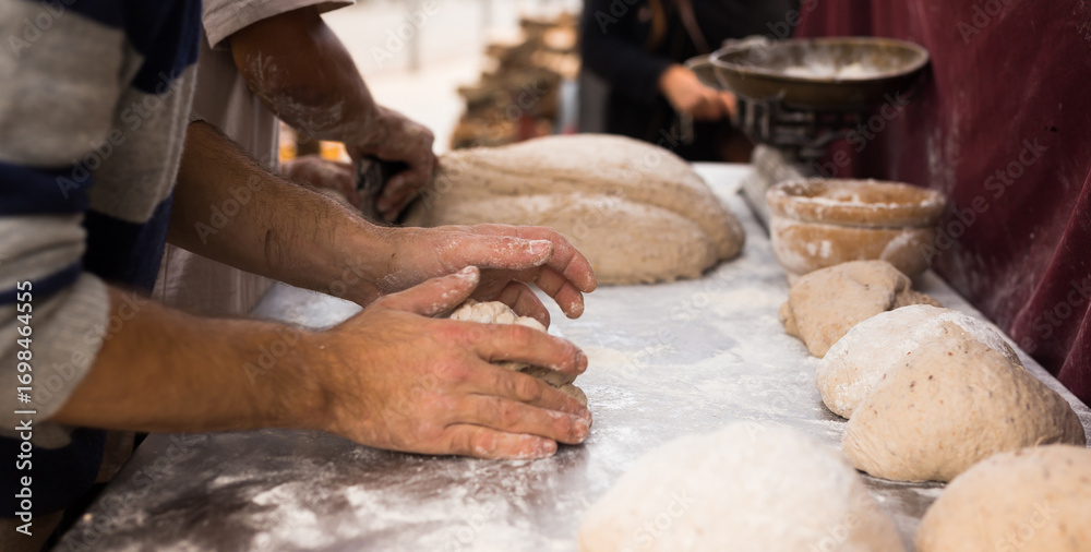 Fototapeta premium process of making bread. dough kneading