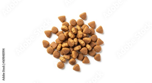 A pile of dry pet food kibble in various shapes on a white background, top view. Essential nutrition for dogs and cats.