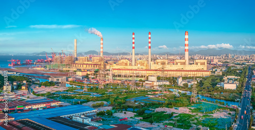 Canvas Print Modern coal-fired power plant with tall chimneys generating electricity for a nearby city on a sunny day