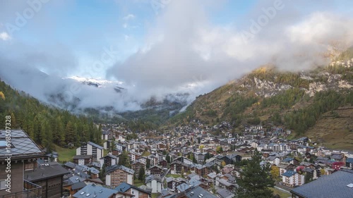 Zermatt Switzerland time lapse city skyline at valley and Matterhorn mountain peak in autumn season