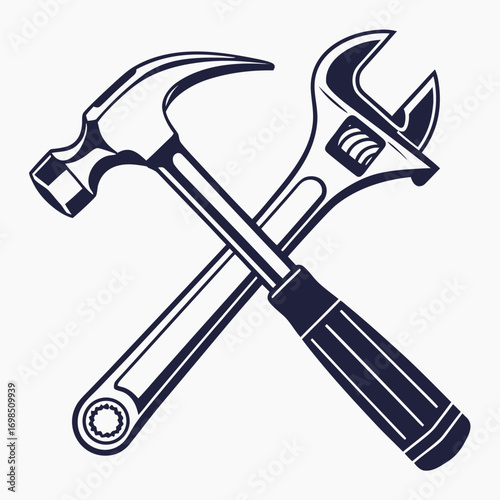 a hammer and wrench crossed over each other
