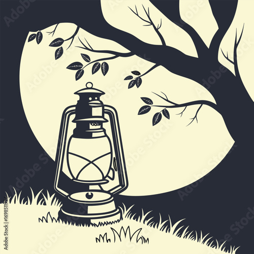 a lantern glowing under a tree at night