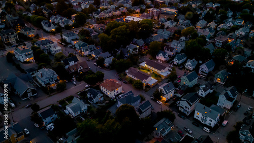 Aerial view of neighborhood at dusk with Victorian homes 