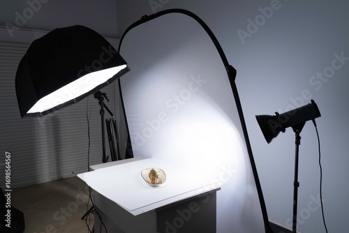 A professional food photography studio setup with an octabox and large diffuser