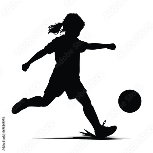 Silhouette of a Young Female Soccer Player Kicking a Ball Mid Air with Great Technique and Poise in an Intense Match
