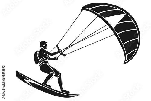 Silhouette of a kitesurfer riding a board