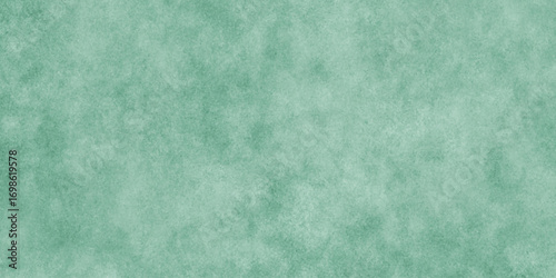 Abstract Elegant dark green background with mottled vintage texture in old fancy background design, texture of colored parchment paper.