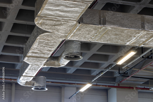 Ventilation pipe system on the ceiling of the large warehouse and hangar