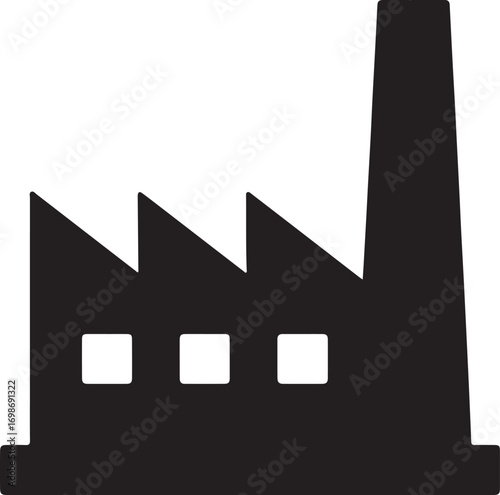 Industrial factory building with a tall smokestack emitting smoke