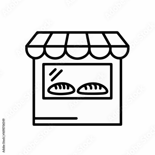 Charming bakery storefront with fresh bread displayed in the window