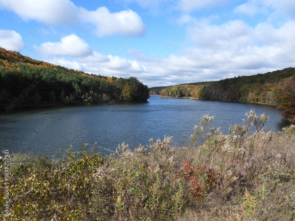 Fototapeta premium The natural beauty of Tuscarora Lake, during the autumn season. Tuscarora State Park, Schuylkill County, Barnesville, Pennsylvania, Appalachian Mountains