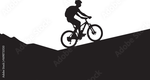 Silhouette of a mountain biker riding uphill on a slope cycling bicycle