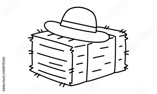 Black and white hat on hay bale drawing