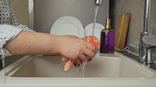 Female hands preparing the trout fish for cooking at home kitchen. Concepts of healthy eating and seafood