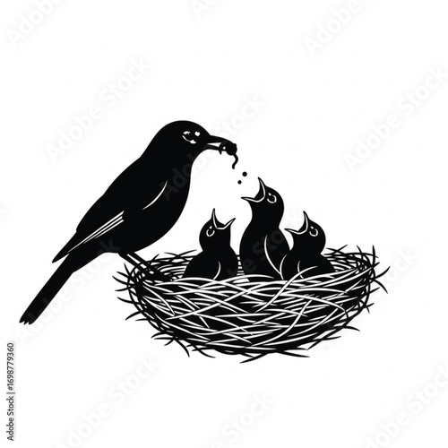 Bird feeding chicks in nest worm