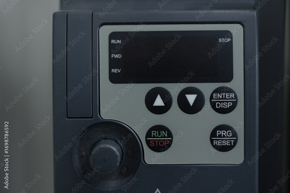 Fototapeta premium Control panel featuring buttons for operation and adjustments in a machinery setup