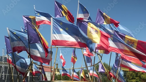 Multiple Gagauzia and Moldova flags waving together in the wind, symbol of regional autonomy and national unity.