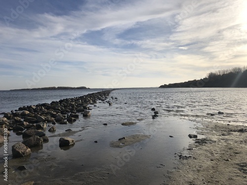 Stone wall in the mudflat in Port Zeelande, Netherlands, Europe