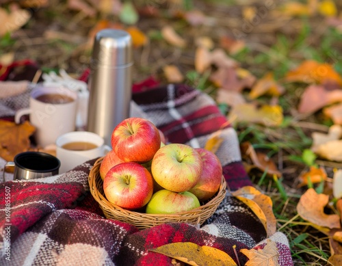 Cozy Autumn Picnic with Apples and Hot Drinks on Blanket