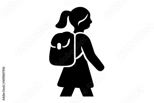 Young girl walking with a backpack on her way to school in a rural area during bright daylight