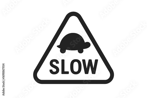 Slow turtle caution sign alerting drivers to reduce speed around wildlife in a residential area