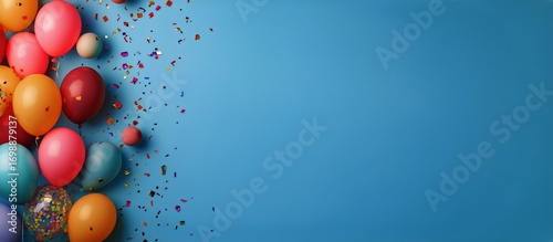Festive Colorful Balloons and Confetti Create a Vibrant Celebration on Blue B...