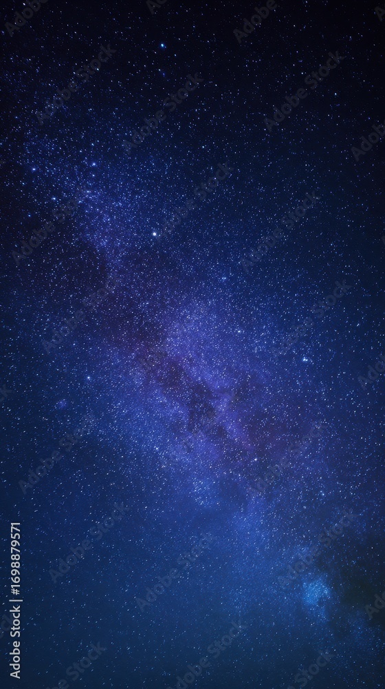 Obraz premium A breathtaking view of the milky way galaxy stretching across the dark night sky, filled with countless stars and nebulae, evoking a sense of wonder and the vastness of the universe
