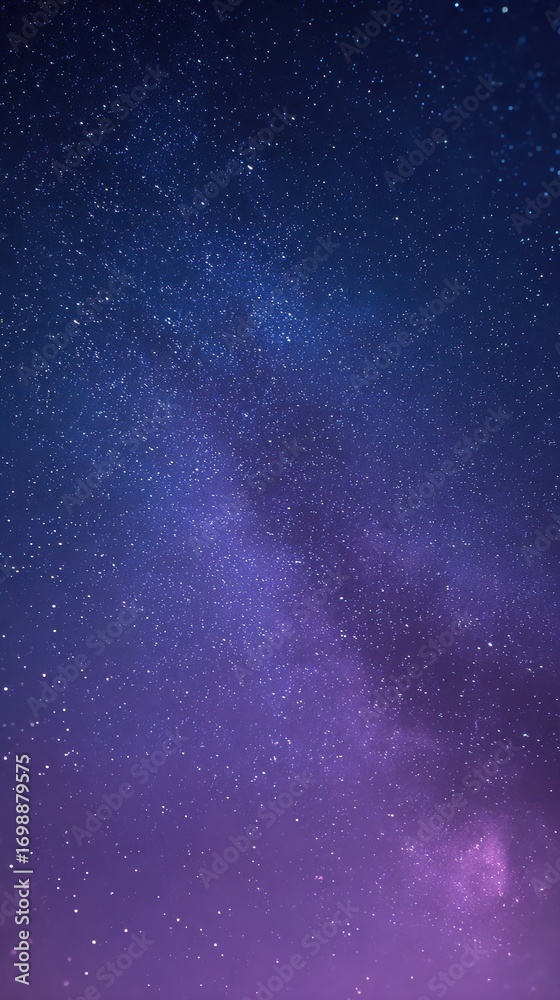 Obraz premium A breathtaking view of the milky way galaxy stretching across a deep blue and purple night sky, filled with countless stars and nebulae