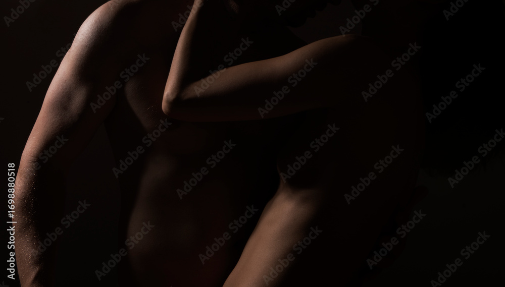 Naklejka premium Sexy couple in tender passion. Beautiful sensual woman and sexy man.