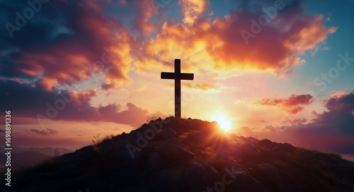 Silhouette of Christian Cross Against Beautiful Sunset Landscape on Hilltop.