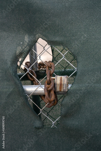 old rusty lock on a fence 