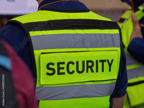 Security Personnel in High-Visibility Safety Vest at Event