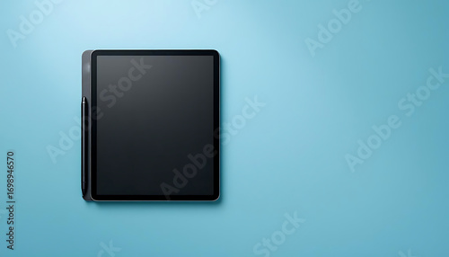A black background highlights the blank screen of a white digital tablet, a modern touchscreen device