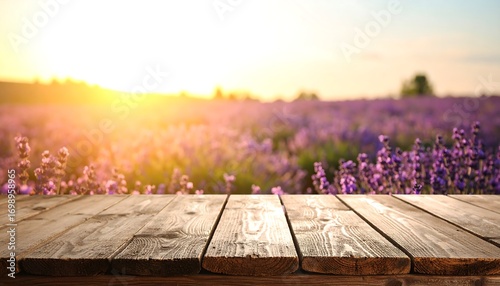 Wooden table over a lavender field at sunset