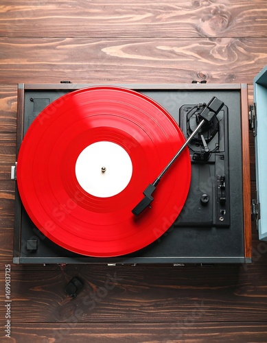 Red vinyl record on vintage turntable