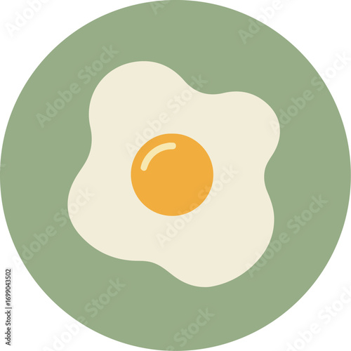 Close-up of a fried egg with vibrant yolk and runny white on a light green background